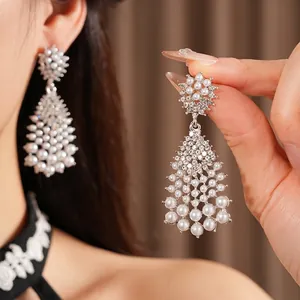 Vintage silver needle pearl drop earrings with sparkling tassels in a court style design
