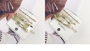 Three-piece gold hair clip set with pearls and geometric metal designs on a display card
