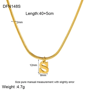 Detail view of 18K gold plated S letter pendant on a 2mm flat snake chain necklace