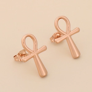 Macro view of 18K rose gold stainless steel Ankh cross earrings with butterfly backings