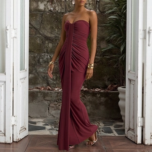 Detail of elegant wine red strapless dress showing ruched fabric and slim fit silhouette