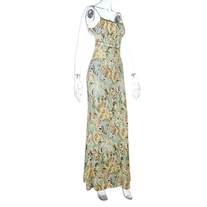 Macro detail of abstract print and slim straps on a summer vacation maxi dress