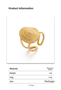 Detailed view of an oval geometric ring with radial texture and 18K gold finish