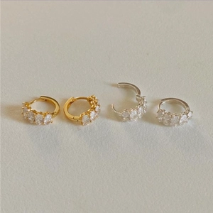 Micro-set zircon hoop earrings in gold and silver finish with five oval-cut stones