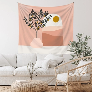 Detail of bohemian tapestry featuring abstract mountains and sun in a cozy living room