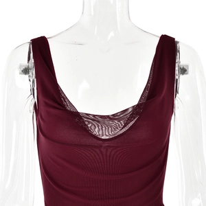 Detail of burgundy mesh cowl neck strap dress with pleated texture on white background