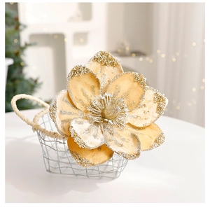 Detail of champagne gold artificial Christmas magnolia with glitter in a white iron basket