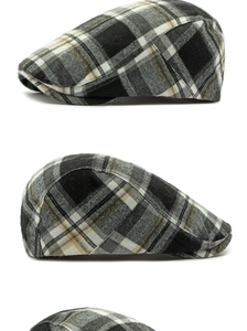 Detailed side view of vintage plaid flat cap with black grey and yellow checkered pattern