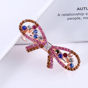 Elegant rose gold alloy bow hair clip featuring colorful rhinestones on a white background