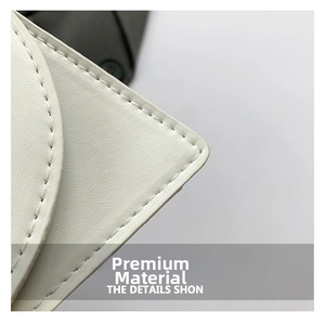 Close-up of premium white leather handbag featuring precise double-needle stitching detail