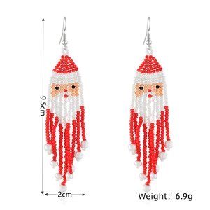Detail view of handmade Santa Claus beaded earrings with size 9.5cm and weight 6.9g