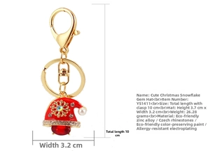 Detail view of the red Christmas hat keychain with rhinestones and pearl pendant charms