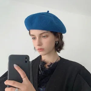 British style blue wool beret for women shown in a mirror selfie for a stylish daily look