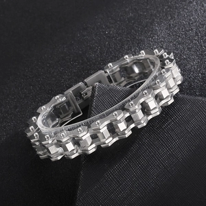 Close-up of industrial style stainless steel bike chain bracelet with brushed finish metal