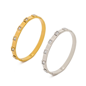 Minimalist titanium steel bangles with square zircon inlay in gold and silver finishes