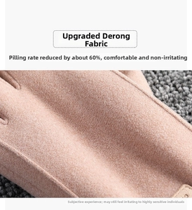 Detailed close-up of pink thermal gloves showing soft anti-pilling velvet fabric texture