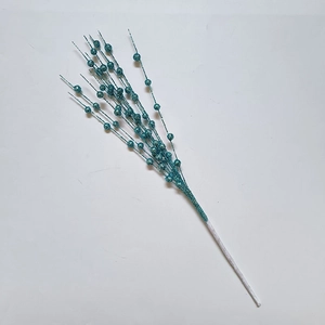 Macro detail of artificial lake blue glitter berry stems for Christmas tree decoration