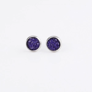 Detailed view of 8mm round blue glitter studs with polished silver stainless steel base