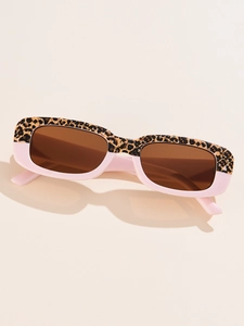 Detail view of rectangular sunglasses with leopard print and pink two-tone frame design