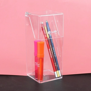 Detailed view of a clear acrylic lipstick organizer with a hinged lid and handle
