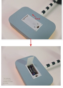 Detail of wooden Christmas sign LED base showing battery compartment for two AA batteries