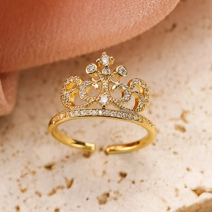 Macro shot of 18K gold crown ring with sparkling white cubic zirconia micro-pave