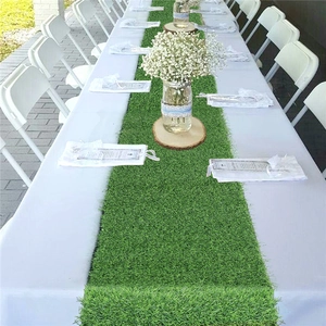 Macro detail of artificial green grass table runner texture for wedding party decoration