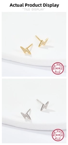 Macro shot of 925 silver lightning bolt earrings in gold and silver with zircon stones