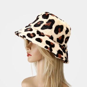 Detailed close-up of thick leopard print faux fur texture on a warm winter bucket hat