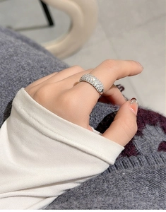 Close-up of S925 sterling silver multi-row zircon stacking ring on female finger
