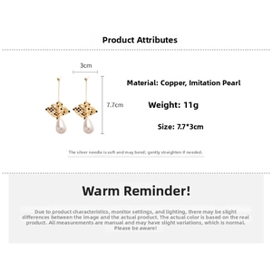 Detailed view of 18k gold-plated drop earrings with pearls and hollow metal mesh design