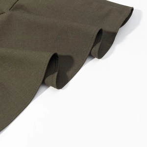 Detailed close-up showing the double-needle hem of an olive green dress fabric