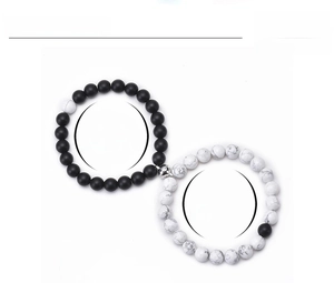 Detail of natural stone couple bracelets with magnetic heart clasps and size parameters