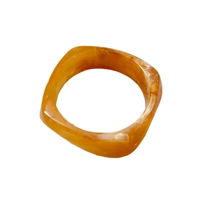Vintage irregular resin bangle in amber tones with natural white marble texture