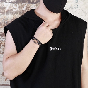 Close-up of black multilayer braided leather bracelet with silver clasp on man's wrist