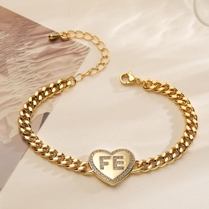 18K gold plated Cuban chain bracelet with a heart pendant featuring FE lettering and zircon