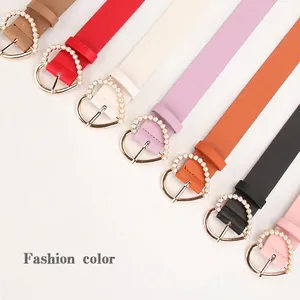 Set of 7 colorful women's skinny belts featuring sweet pearl heart-shaped metal buckles