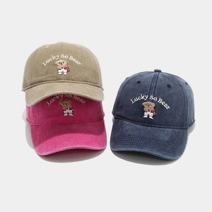 Washed cotton baseball caps with bear Lucky embroidery in khaki, navy, and rose red