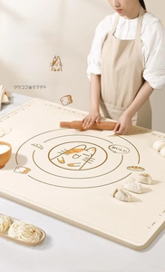 Detail of food-grade silicone kneading mat with cat pattern and scale markings