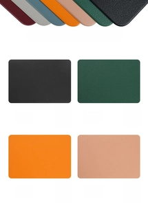Detailed view of heat-resistant faux leather placemats in multiple vibrant colors