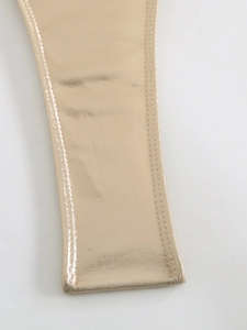 Detailed macro view of champagne gold metallic fabric strap with fine double-stitch sewing