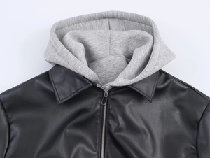 Detail view of the contrast grey hood and black faux leather jacket collar stitching