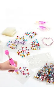 Pink hair gem machine set with colorful rhinestones for DIY hair styling and beauty art