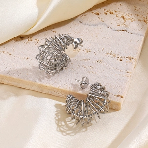 Silver spring hoop earrings in C-shape wire wrap design on a premium stone plate