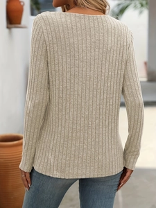 Detail of the vertical ribbed texture and slim fit design on the back of this beige knit top