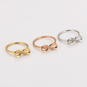 Infinity symbol rings with crystals in gold, silver, and rose gold stainless steel