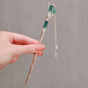 Elegant gold bamboo hair pin with green segments and beaded tassels for traditional hairstyles
