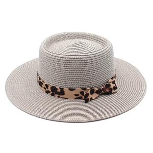 Flat top straw sun hat with leopard print ribbon and bow for summer beach vacation