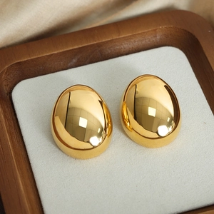Polished gold egg-shaped drop earrings with a reflective metallic finish for women