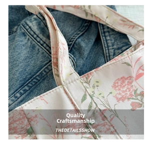 Close-up of floral canvas tote bag featuring neat stitching and pink flower patterns